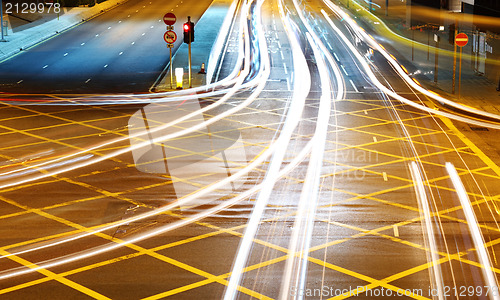 Image of car with blur light through city at night