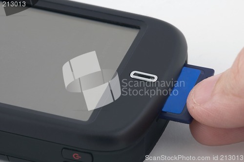 Image of Man inserts memory card