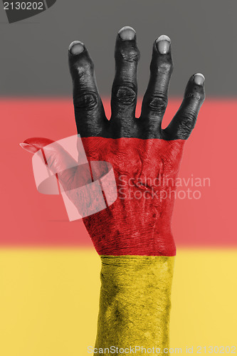 Image of Old hand with flag, European Union, Germany