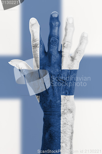 Image of Old hand with flag, European Union, Finland