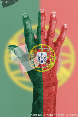 Image of Old hand with flag, European Union, Portugal