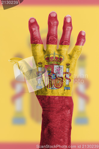 Image of Old hand with flag, European Union, Spain