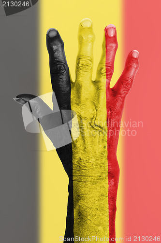 Image of Old hand with flag, European Union, Belgium