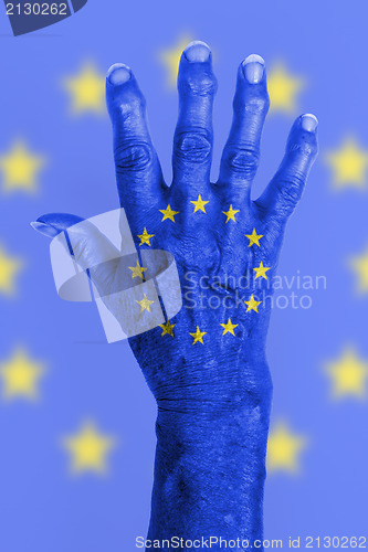 Image of Old hand with flag, European Union, EU