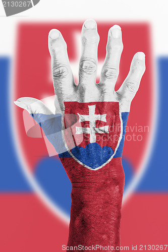 Image of Old hand with flag, European Union, Slovakia