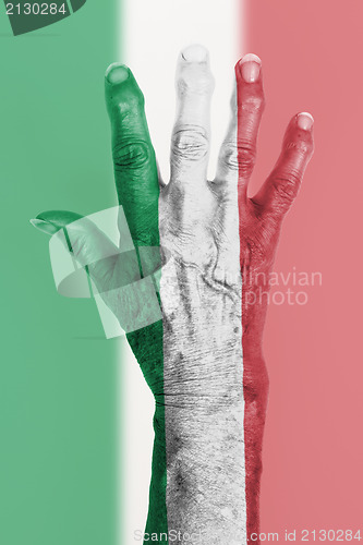 Image of Old hand with flag, European Union, Italy