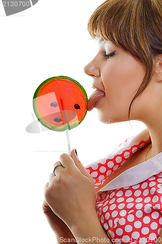 Image of girl licks a lollipop