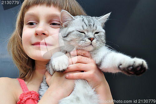Image of child with a cat