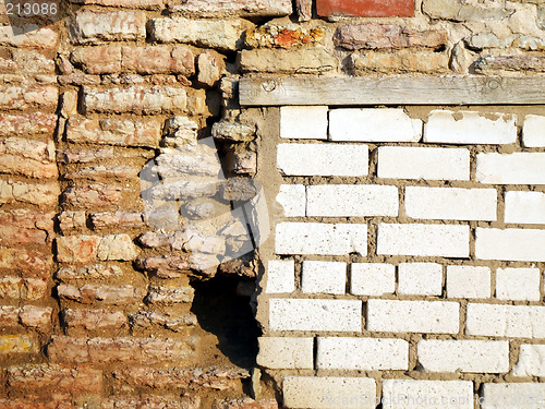 Image of New and old brick walls joint