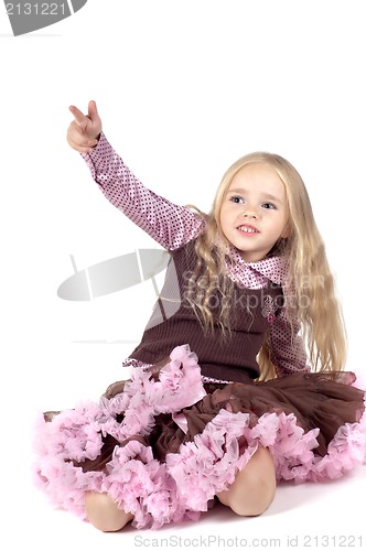 Image of Little girl in brown and pink clothes
