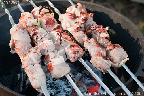 Image of Shish kebab preparation on a brazier