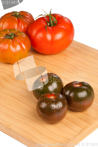Image of Red and green tomatoes