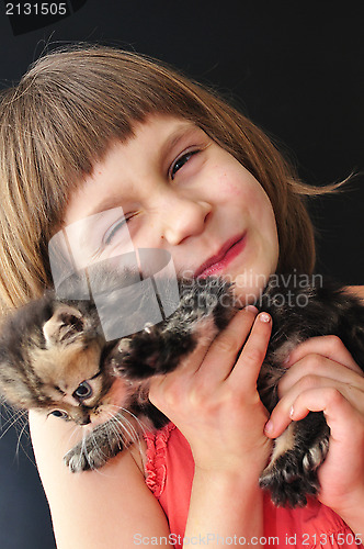 Image of happy little girl with a cat
