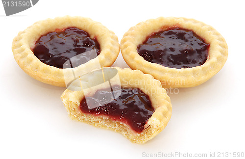 Image of Three jam tarts, one with a bite taken