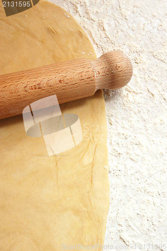Image of Portrait image of pastry being rolled out on a floured surface