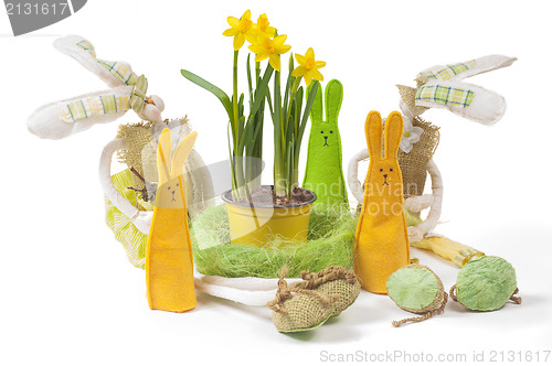 Image of Yellow narcissus in the pot and five bunnies