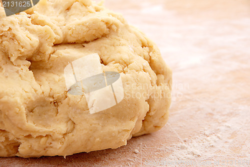 Image of Fresh pastry on a floured wooden board