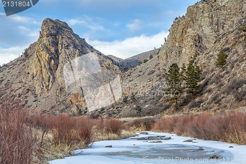 Image of frozen stream and landmark rock