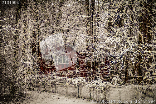 Image of red barn in snow