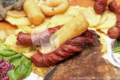 Image of sausages and potatoes