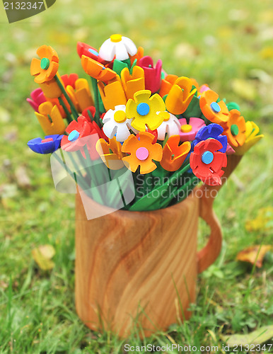 Image of Bouquet multicolored artificial flowers in a vase