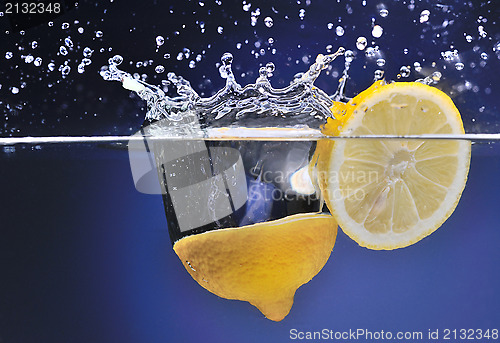 Image of Lemon thrown into the water, motion, background