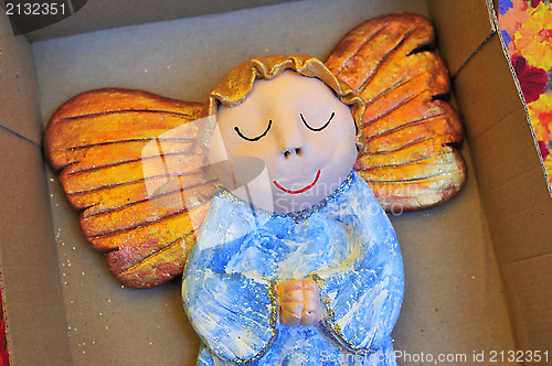 Image of Little wooden painted angel figure sleeping in box