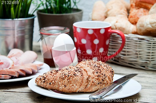 Image of traditional french breakfast on table in morning