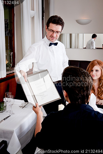 Image of man and woman in restaurant for dinner