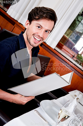 Image of man and woman in restaurant for dinner