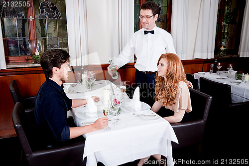 Image of man and woman for dinner in restaurant