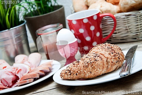 Image of traditional french breakfast on table in morning