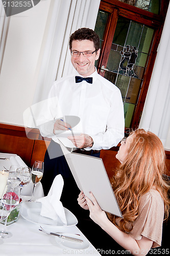 Image of man and woman in restaurant for dinner