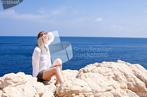 Image of young girl with brown hat in summer holiday