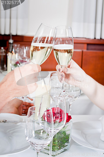 Image of happy smiling couple in restaurant celebrate