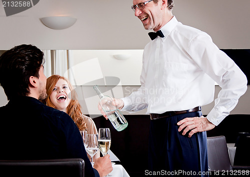 Image of man and woman for dinner in restaurant