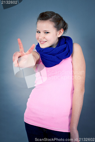 Image of young teenager girl smiling having fun