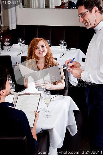 Image of man and woman in restaurant for dinner