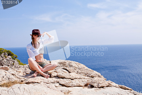Image of young girl with brown hat in summer holiday