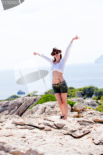 Image of young girl with brown hat in summer holiday