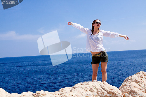 Image of young girl with brown hat in summer holiday