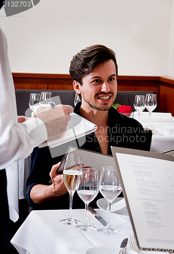 Image of man and woman in restaurant for dinner