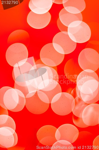 Image of Abstract background. Blurred colorful circles bokeh orange toned