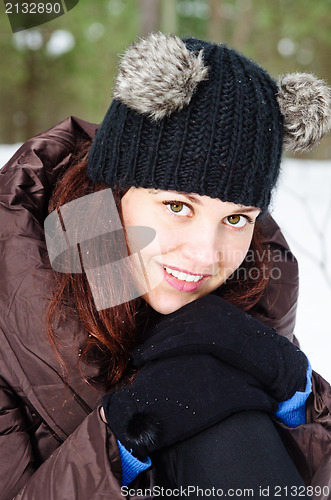 Image of Portrait of the charming young woman in winter outdoors 