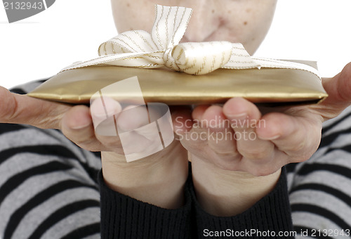 Image of Young woman holding a present