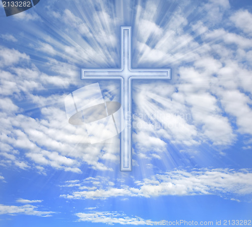 Image of Christian cross with light beams over sky