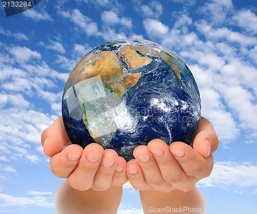 Image of Hands of woman holding globe, Africa and Near East