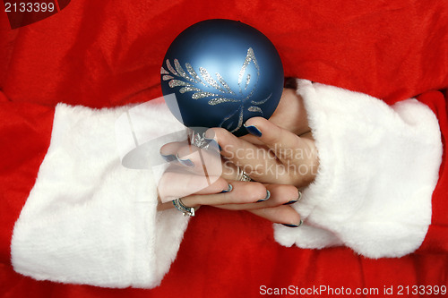 Image of Santa claus hiding a blue ball