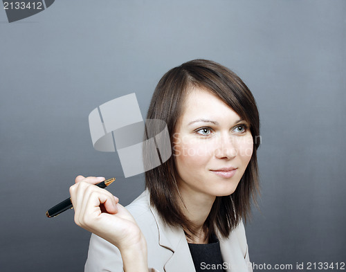 Image of Woman holding a pen 