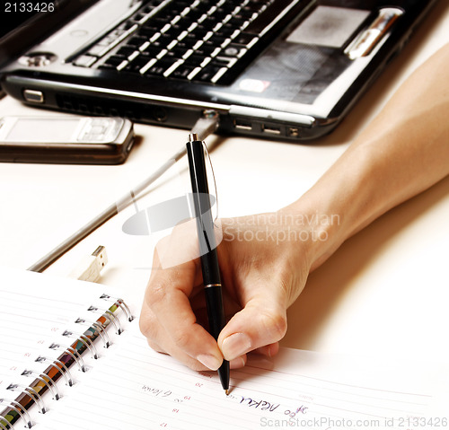 Image of Businesswoman writing